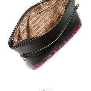 Black w/ red roses cross body Moschino bag.